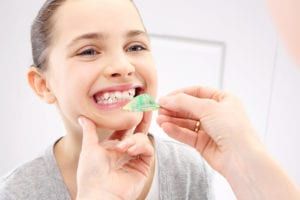 young girl having braces