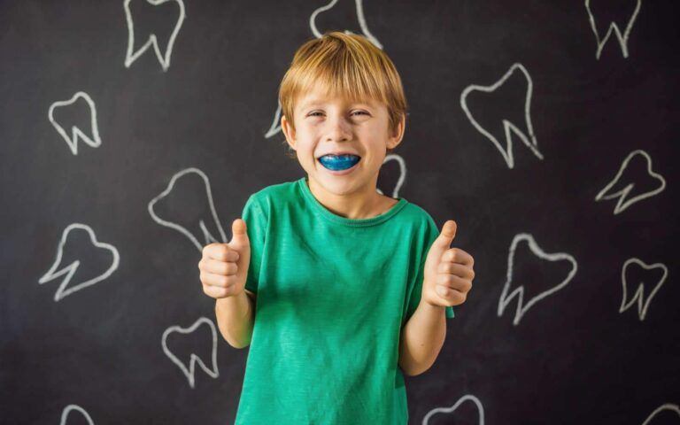 Child Posing with Mouth Guard